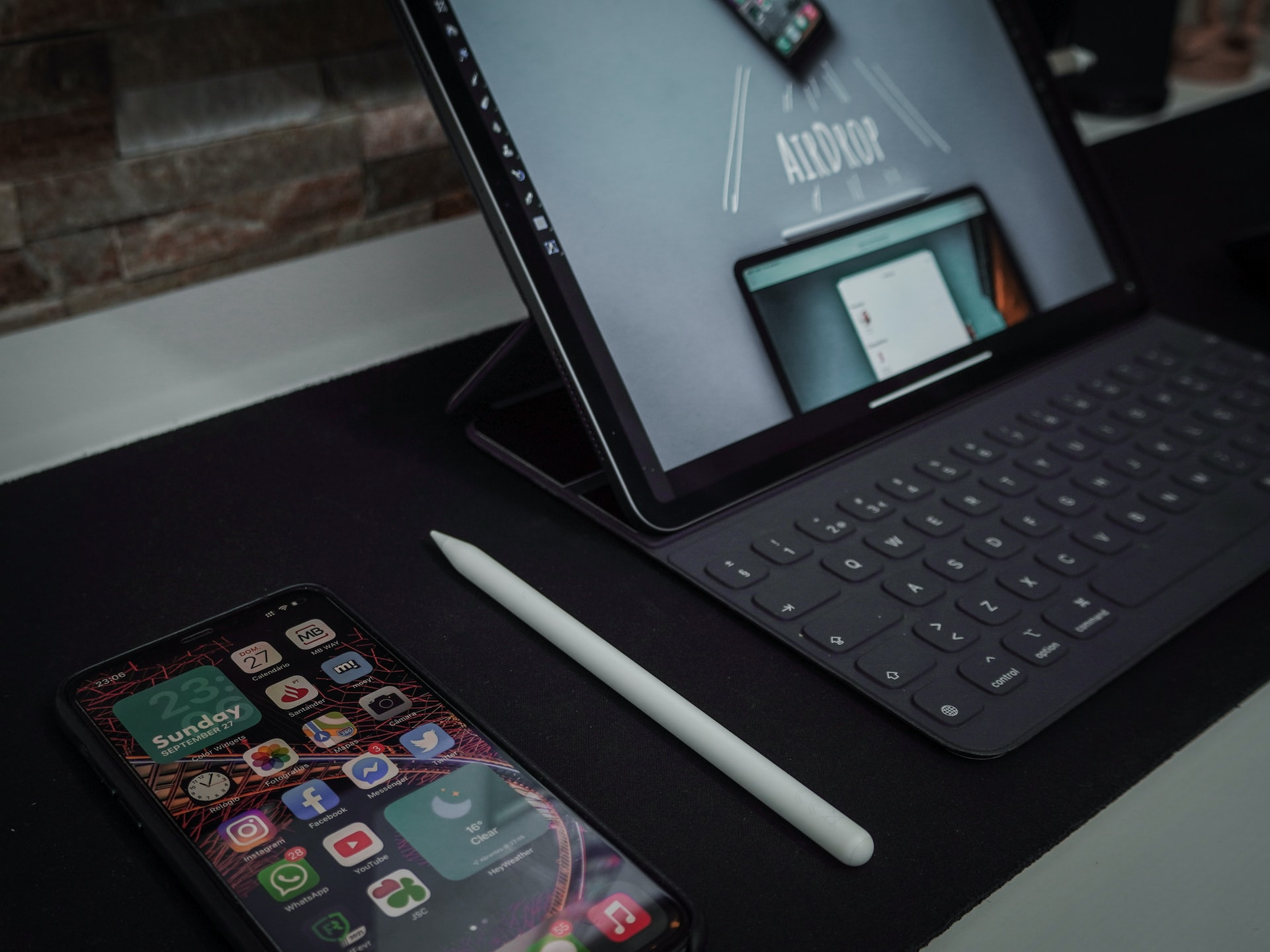Smartphone and laptop showing AirDrop