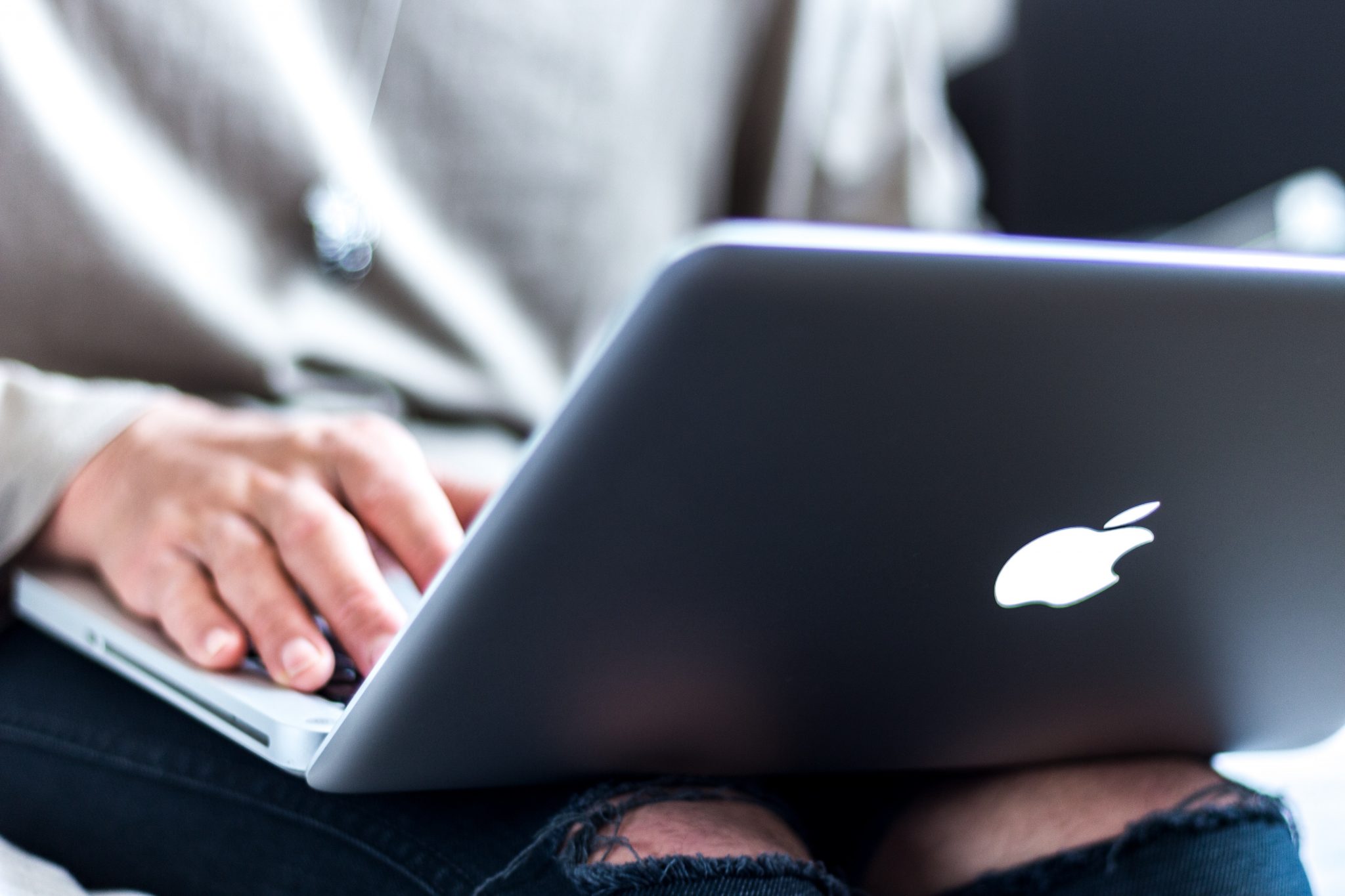 A person using a MacBook