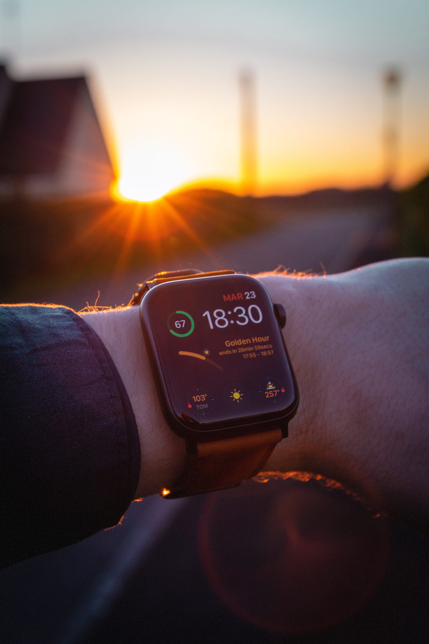Apple Watch in front of a sunset