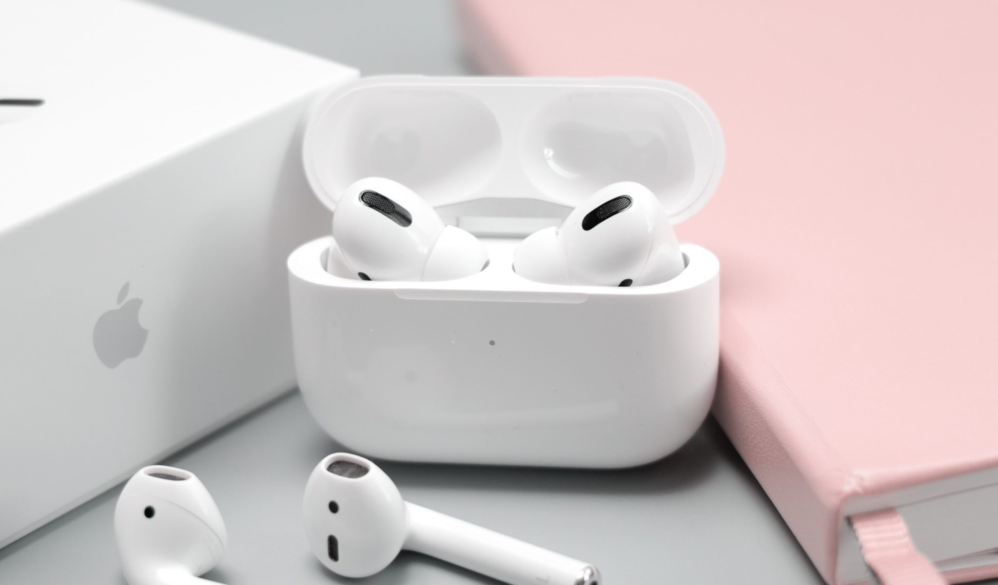 AirPods in case with Apple logo